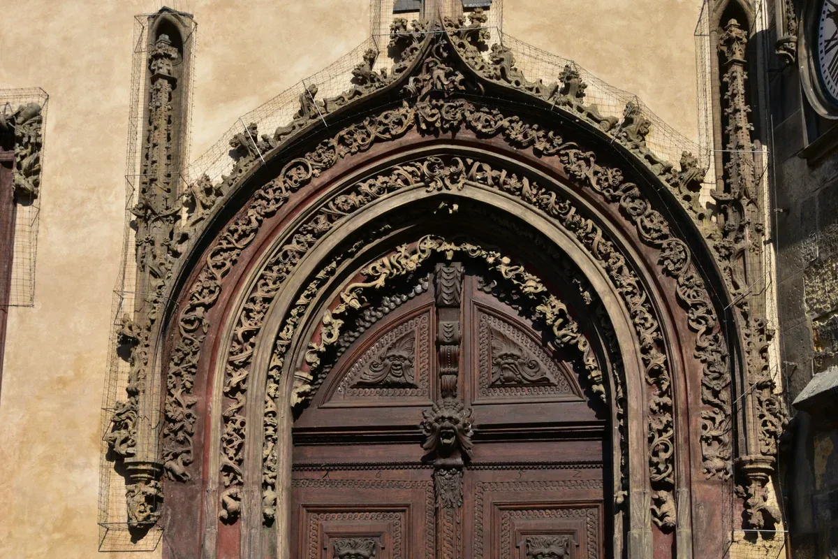 Carved Gothic portal of the Old Town Hall near the start of a Prague Jewish Quarter tour